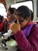 A girl looks into a microscope at a Skills field trip to the Foss Waterway.